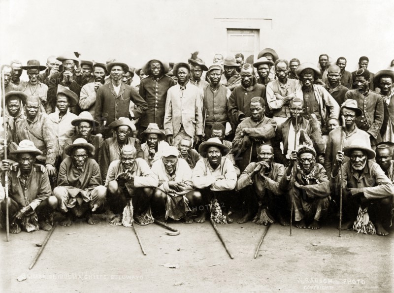 Matabele indunas. A number of Matabele (Ndebele) indunas (chiefs) pose for a group portrait outdoors after an indaba (council) with British officials following the Matabele rebellion of 1896. Bulawayo, Rhodesia (Zimbabwe), 1897. Bulawayo, Matabeleland North, Zimbabwe, Southern Africa, Africa.