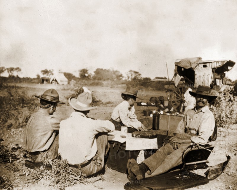 Captain Lawley relaxes in camp. Captain Arthur Lawley (1860-1932) (front right) rests with fellow European travellers during an overland journey from South Africa to Rhodesia. Accompanied by Earl Grey (1851-1917), he was travelling with relief forces and supplies to Bulawayo, which had been besieged during the Matabele rebellion. Probably Matabeleland, Rhodesia (Matabeleland South, Zimbabwe), circa March 1896., Matabeleland South, Zimbabwe, Southern Africa, Africa.
