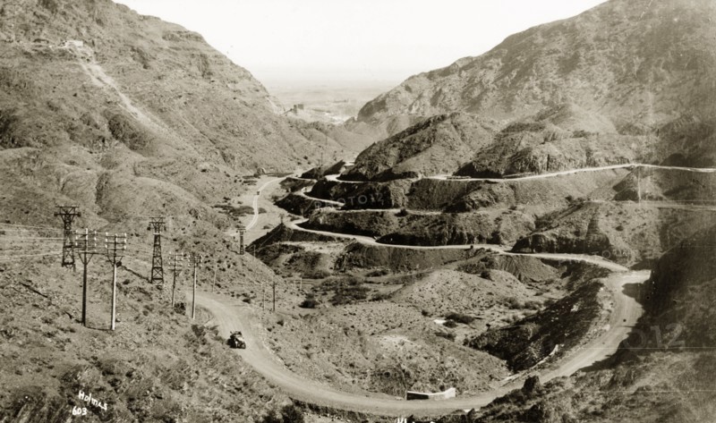View of the Khyber Pass. A motorcar travels along the winding Khyber Pass, a strategically important route in the Safed Koh Mountains, connecting British India (now Pakistan) with Afghanistan. Landi Khana, North West Frontier Province, India (Pakistan), circa 1924., North West Frontier Province, Pakistan, Southern Asia, Asia.