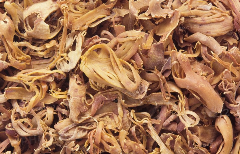 Mace. Mace (Myristica fragrans) is the dried covering of nutmeg, the seed of an evergreen tree indigenous to southeast Asia and Australasia. It is commonly used as a spice when cooking soups, sauces and baked goods, and delivers an aromatic, sweet taste. India. India, Southern Asia, Asia.