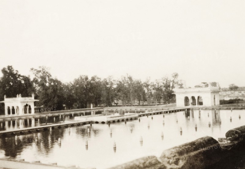 The Shalimar Gardens in Lahore. View across a rectangular marble pool and Mughal-style summer pavillions at Shalimar Gardens in Lahore. Lahore, Punjab, India (Pakistan), 1920. Lahore, Punjab, Pakistan, Southern Asia, Asia.
