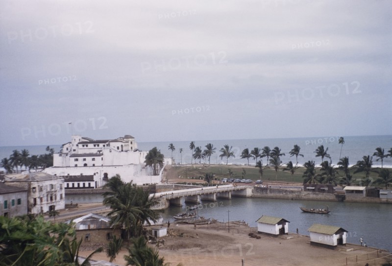 Fishing harbour behind Elmina Castle. The fishing harbour behind Elmina Castle, viewed from Fort St Jago on an adjacent hilltop. Elmina, Ghana, circa 1959. Elmina, Central (Ghana), Ghana, Western Africa, Africa.