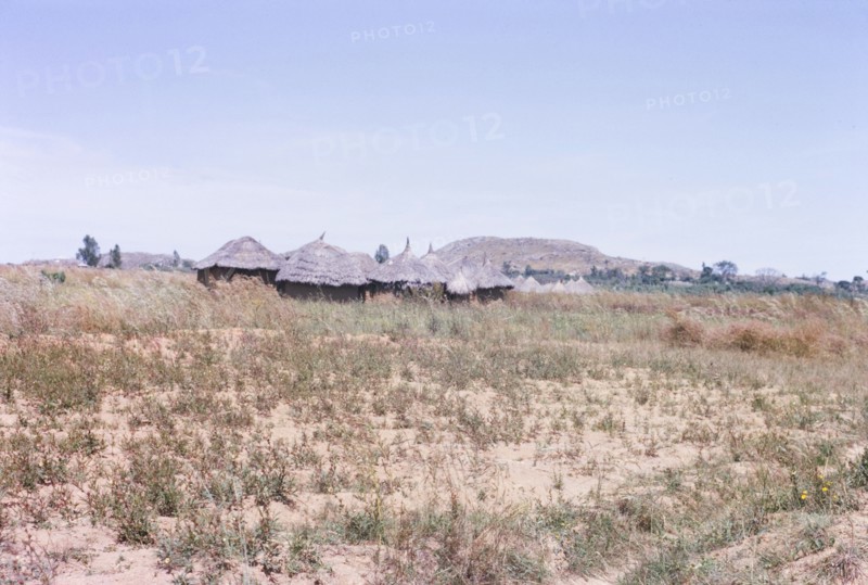 A Hausa village on the Nigerian plains. The thatched roofs of a Hausa settlement located on the Nigerian plains. Nigeria, October 1963. Nigeria, Western Africa, Africa.
