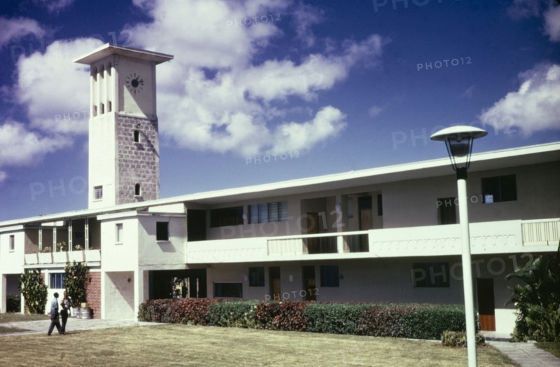Cave Hill Campus, University of West Indies. View of Cave Hill campus at the University of West Indies in Barbados. The low, two-storey building features verandas running the length of the facade and a colonial-style, square clock tower. Cave Hill, Barbados, circa 1975. Cave Hill, St Michael, Barbados, Caribbean, North America .