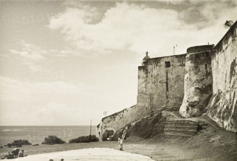 Fort Jesus on Mombasa Island. View of Fort Jesus, a Portuguese fort built on Mombasa Island in 1593 to guard the Old Port of Mombasa. At the time of this photograph, and up until 1958 while Kenya was a British colony, the fort was used as a government prison. Mombasa, Kenya, 1933. Mombasa, Coast, Kenya, Eastern Africa, Africa.