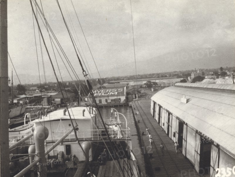 Kingston Harbour, Jamaica. View over the docks at Kingston Harbour, showing the roof of a 'Myer's Rum' warehouse. Kingston, Jamaica, circa 1935. Kingston, Kingston, Jamaica, Caribbean, North America .