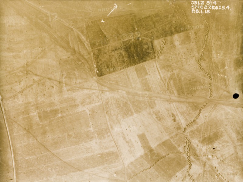 Position of a British Field Battery Company. One of a series of British aerial reconnaissance photographs recording the positions of trenches on the Western Front during the First World War. An original caption indicates the position of a British Field Battery Company within the darker area of plantation at the top of the image. A strongly fortified trench zig-zags its way across fields to the east. Nord-Pas de Calais or Picardie, France, 28 January 1918., Nord-Pas de Calais, France, Western Europe, Europe .