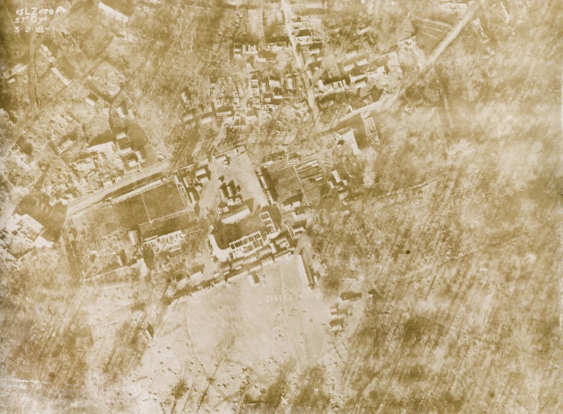 Aerial view of a bomb-damaged village. One of a series of British aerial reconnaissance photographs recording the positions of trenches on the Western Front during the First World War. A small French village lies in ruins, riddled with bomb craters, after suffering a continuous barrage of artillery fire. Nord-Pas de Calais or Picardie, France, 3 February 1918., Nord-Pas de Calais, France, Western Europe, Europe .