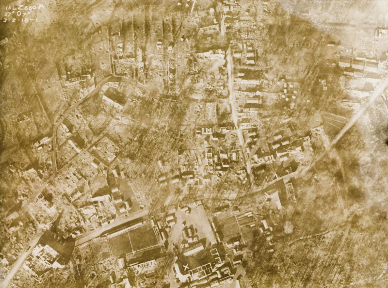 Aerial view of a bomb-damaged village. One of a series of British aerial reconnaissance photographs recording the positions of trenches on the Western Front during the First World War. A small French village lies in ruins, riddled with bomb craters, after suffering a continuous barrage of artillery fire. Nord-Pas de Calais or Picardie, France, 3 February 1918. France, Western Europe, Europe .