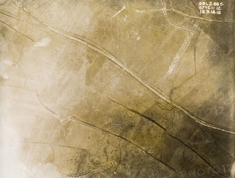 Aerial view of a trench system on the Western Front. One of a series of British aerial reconnaissance photographs recording the positions of trenches on the Western Front during the First World War. An intricate system of square-toothed trenches cut across fields pockmarked with bomb craters. Nord-Pas de Calais or Picardie, France, 12 March 1918., Nord-Pas de Calais, France, Western Europe, Europe .