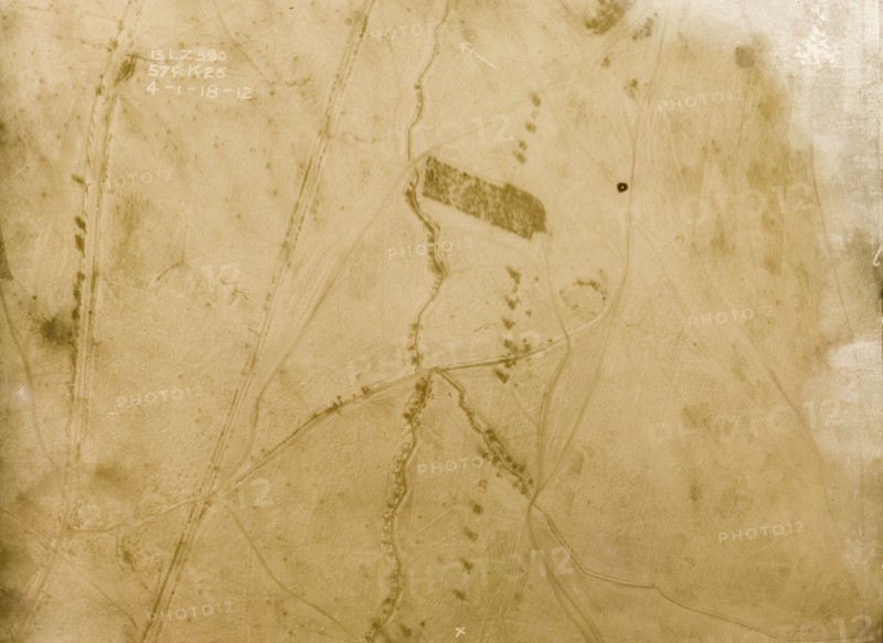 A snow-covered battlefield. One of a series of British aerial reconnaissance photographs recording the positions of trenches on the Western Front during the First World War. A trench zig-zags its way northeast to southwest across snow-covered fields, surrounded by transport tracks. Nord-Pas de Calais or Picardie, France, 4 January 1918., Nord-Pas de Calais, France, Western Europe, Europe .