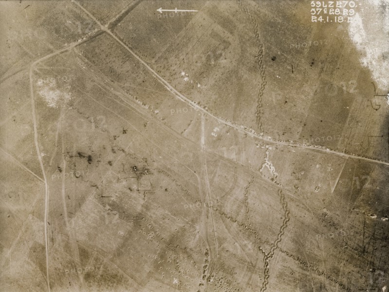 Aerial view of a bomb-damaged landscape. One of a series of British aerial reconnaissance photographs recording the positions of trenches on the Western Front during the First World War. Square-toothed trenches zig-zag their way across fields pockmarked with bomb craters. Nord-Pas de Calais or Picardie, France, 24 January 1918., Nord-Pas de Calais, France, Western Europe, Europe .