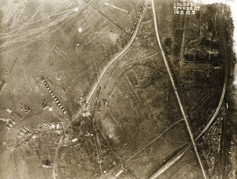 A military camp on the Western Front. One of a series of British aerial reconnaissance photographs recording the positions of trenches on the Western Front during the First World War. A military camp is surrounded by square-toothed trenches and fields pockmarked with bomb craters. Nord-Pas de Calais or Picardie, France, 16 February 1918., Nord-Pas de Calais, France, Western Europe, Europe .