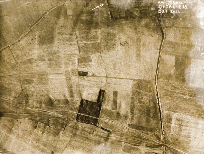 Transport tracks and bomb craters. One of a series of British aerial reconnaissance photographs recording the positions of trenches on the Western Front during the First World War. Transport tracks run across a patchwork of fields pockmarked with bomb craters. Nord-Pas de Calais or Picardie, France, 28 January 1918., Nord-Pas de Calais, France, Western Europe, Europe .