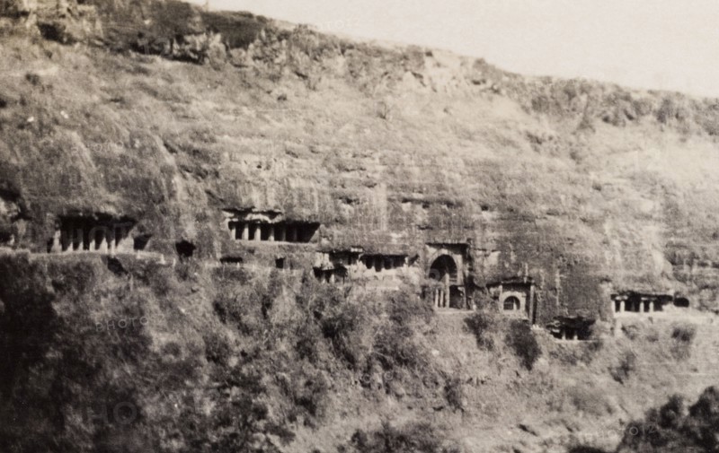 Ajanta caves. A number of pillared entrances carved into the Ajanta ravine mark the location of the Ajanta caves, a series of ancient caves that feature Buddhist religious art including ornate frescoes and sculptures. Near Aurangabad, Bombay Presidency (Maharashtra), India, circa 1926. Aurangabad, Maharashtra, India, Southern Asia, Asia.
