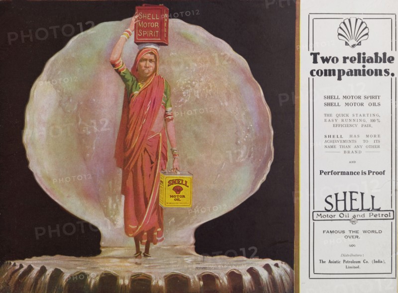 Two reliable companions'. Advertisement for Shell motor oil and motor spirit from the Asiatic Petroleum Co. (India) Limited. The illustration depicts an Indian woman in a sari standing inside an open cockle shell. She carries a can of motor spirit on her head and a can of motor oil in her hand. India, circa 1925. India, Southern Asia, Asia.