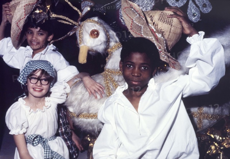 Children at a Commonwealth Institute festival. Children in costume pose beside a large-scale model of a white bird during a cultural festival held at the Commonwealth Institute. London, England, circa 1985. London, London, City of, England (United Kingdom), Western Europe, Europe .