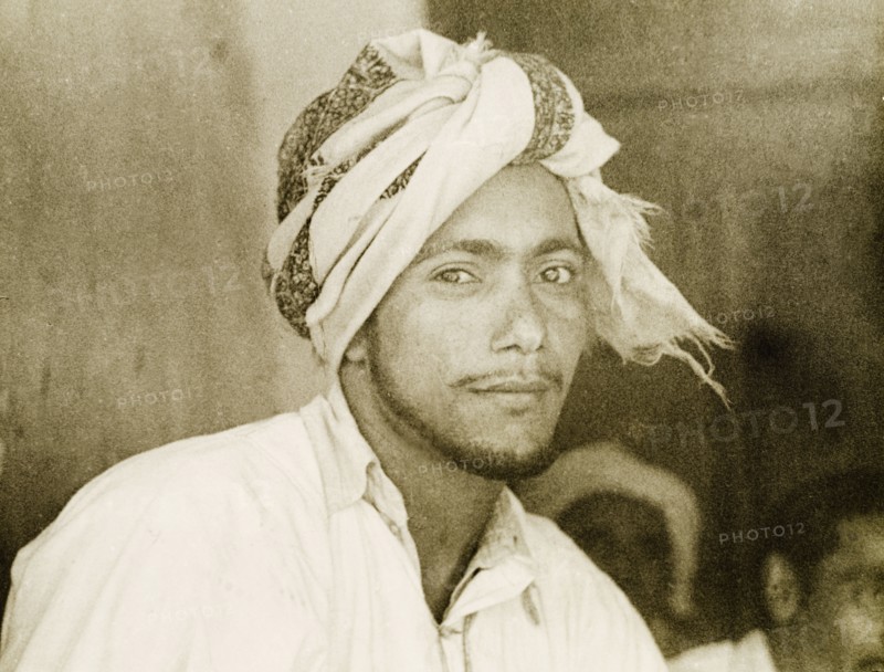 A dhow sailor. Portrait of a turbaned dhow sailor at the port city of Mombasa. Mombasa, Kenya, 1947. Mombasa, Coast, Kenya, Eastern Africa, Africa.