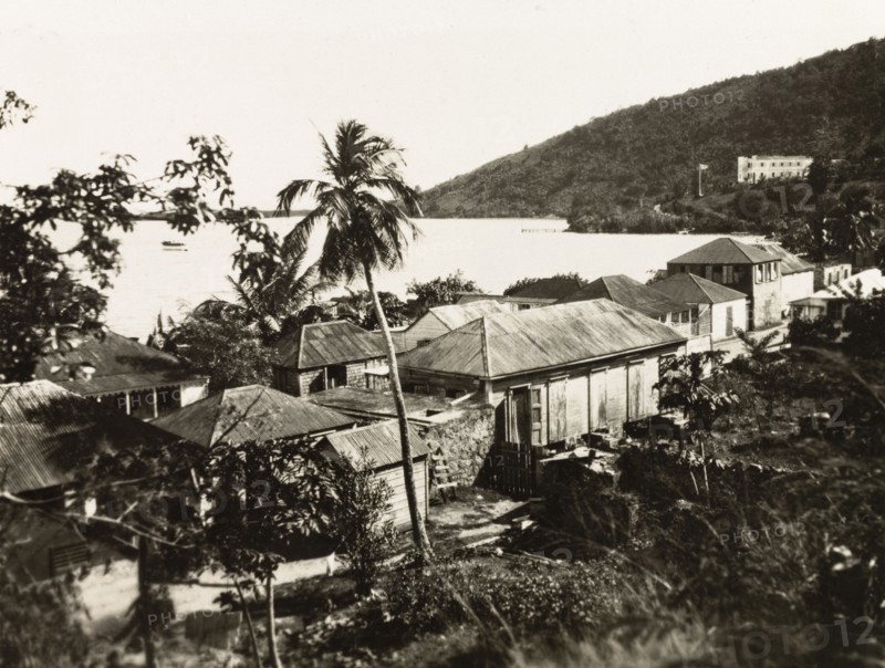 Tortola. View over a coastal settlement on the island of Tortola to the Caribbean Sea. Tortola, British Virgin Islands, circa 1931., Tortola, British Virgin Islands, Caribbean, North America .