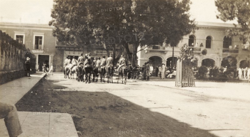 Rurales in Santo Domingo. A band of 'rurales' (Mexican rural guards) ride on horseback through a city square in Santo Domingo. Santo Domingo, Dominican Republic, circa 1913. Santo Domingo, Santo Domingo, Dominican Republic, Caribbean, North America .