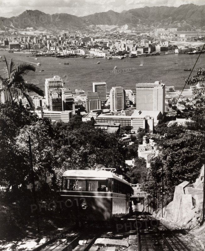 The Peak Tramway, Hong Kong. A tram runs along the Peak Tramway to the top of Victoria Peak, a tourist hotspot that commands views over Hong Kong Island's Central District, Victoria Harbour and the Kowloon peninsula. Hong Kong, China, 1963. Hong Kong, Hong Kong, China, People's Republic of, Eastern Asia, Asia.