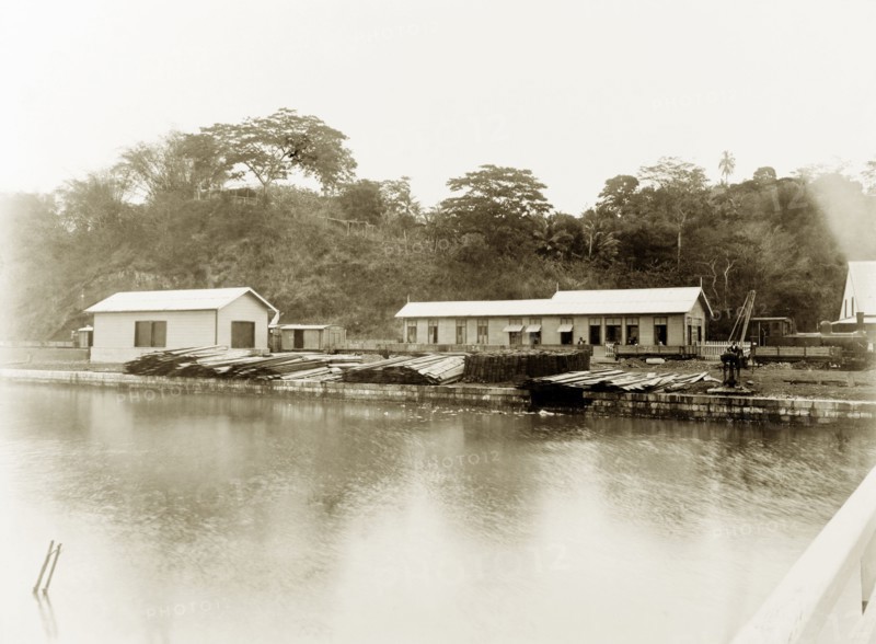 San Fernando railway station, Trinidad. View across a river to a steam locomotive pulled in at San Fernando railway station. San Fernando, Trinidad, circa 1912. San Fernando, Trinidad and Tobago, Trinidad and Tobago, Caribbean, North America .
