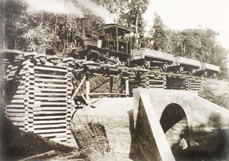 Locomotive travelling across culvert 'No. 35' . A steam locomotive travels across culvert 'No. 35' on an extended section of railway line built by Trinidad Government Railways to connect Rio Claro to the rail network. Trinidad, 11 September 1913., Trinidad and Tobago, Trinidad and Tobago, Caribbean, North America .