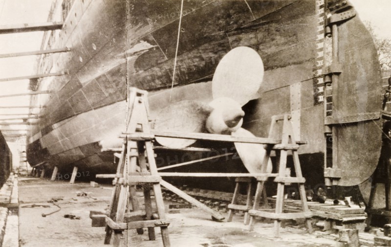 Ship at Kidderpore dry dock. View of a large ship dry-docked at Kidderpore dock, supported by a series of timber beams. Calcutta (Kolkata), India, 1931. Kolkata, West Bengal, India, Southern Asia, Asia.