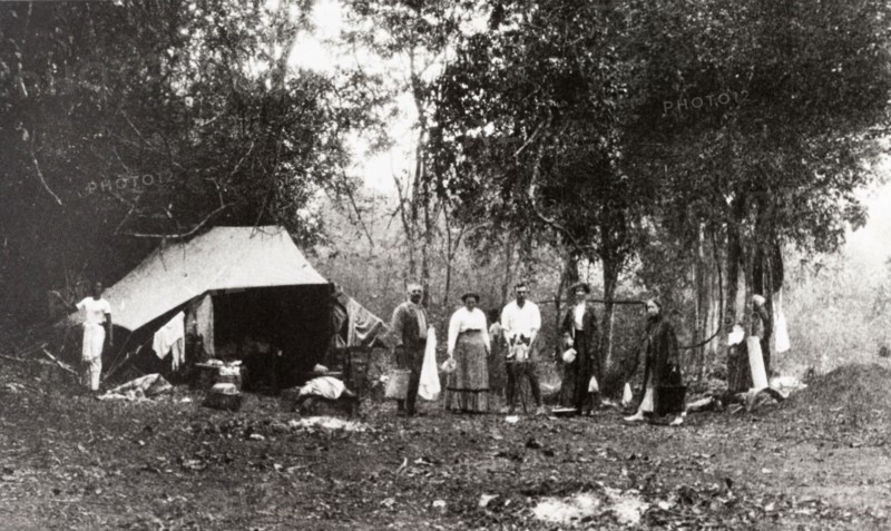Hunting party camp, Ceylon. A group of Europeans attending an elephant kraal or drive pose at their camp site located in a jungle clearing. Ceylon (Sri Lanka), 1912. Sri Lanka, Southern Asia, Asia.
