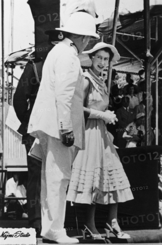 Queen Elizabeth II in Aden. Queen Elizabeth II chats with a uniformed dignitary, possibly the Governor of Aden, Sir Tom Hickinbotham, during her visit to Aden as part of her royal tour of the Commonwealth from November 1953 to May 1954. Aden, Yemen, 27 April 1954. Aden, Adan, Yemen, Middle East, Asia.