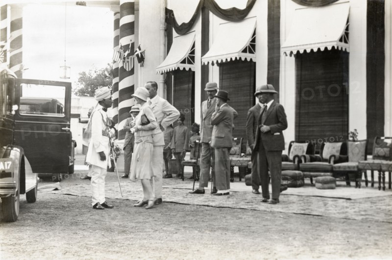 Sir Bertrand and Lady Glancy at Jaora. Sir Bertrand and Lady Glancy chat wth an Indian dignitary as they await the arrival of Lord Irwin, Viceroy of India, at the Nawab of Jaora's palace. Jaora State, Malwa Agency (Madhya Pradesh), India, 3 August 1928., Madhya Pradesh, India, Southern Asia, Asia.
