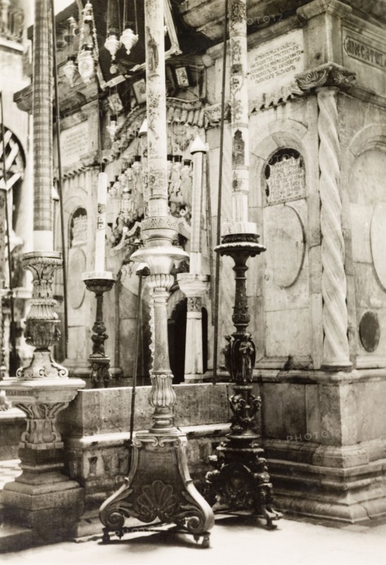 Tomb of Jesus, Jerusalem. View of the large, elaborate candlesticks flanking the entrance to the Tomb of Jesus inside the Church of the Holy Sepulchre, a Christian church believed to be built over Calvary (Golgotha), the hill on which Jesus was crucified. Jerusalem, British Mandate of Palestine (Israel), circa 1942. Jerusalem, Jerusalem, Israel, Middle East, Asia.