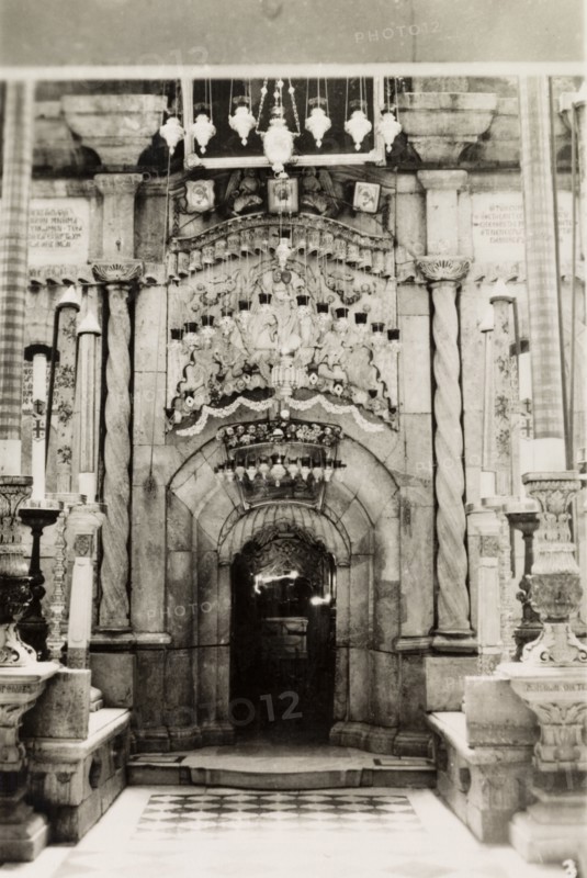 Tomb of Jesus, Jerusalem. View of the ornate aedicule marking the Tomb of Jesus inside the Church of the Holy Sepulchre, a Christian church believed to be built over Calvary (Golgotha), the hill on which Jesus was crucified. Jerusalem, British Mandate of Palestine (Israel), circa 1942. Jerusalem, Jerusalem, Israel, Middle East, Asia.