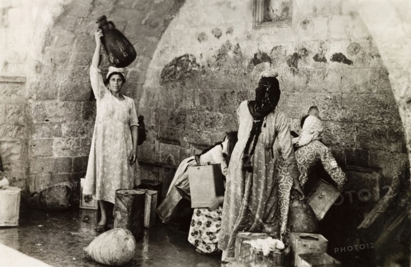 The Virgin's Fountain, Nazareth. Women collect water from the Virgin's Fountain (also known as Mary's Well) in Nazareth. According to Greek Orthodox tradition, the archangel Gabriel revealed the Annunciation to Mary, the mother of Jesus, as she was collecting water from a well near this site. Nazareth, British Mandate of Palestine (Israel), circa 1942. Nazareth, North (Israel), Israel, Middle East, Asia.