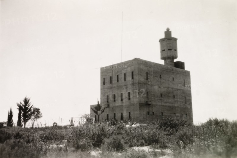 Fortified police building, Palestine. View of a large, fortified building with a projecting octagonal watchtower. This building was possibly used by British police forces as a gaol or police headquarters. British Mandate of Palestine (Middle East), circa 1942., Middle East, Asia.