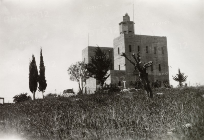 Fortified police building, Palestine. View of a large, fortified building with a projecting octagonal watchtower. This building was possibly used by British police forces as a gaol or police headquarters. British Mandate of Palestine (Middle East), circa 1942., Middle East, Asia.