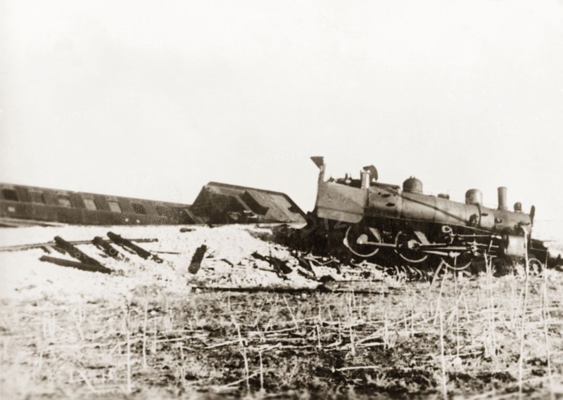 Derailed steam locomotive at Ras el Ain. A steam locomotive lies in pieces on a railway embankment, derailed in a sabotage attack by Palestinian Arab dissidents during the Great Uprising (1936-39). Ras el Ain, British Mandate of Palestine (Israel), circa 1938. Israel, Middle East, Asia.
