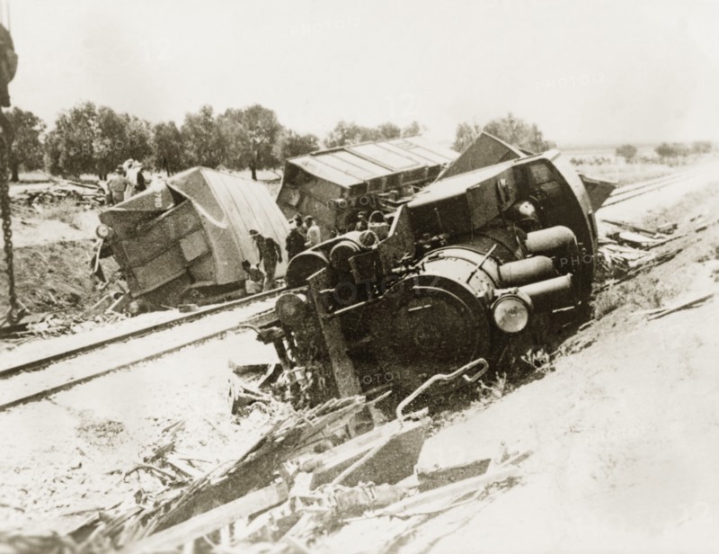 Derailed steam locomotive at Lydda. A steam locomotive lies upturned on a railway embankment, derailed in a sabotage attack by Palestinian Arab dissidents during the Great Uprising (1936-39). Lydda, British Mandate of Palestine (Lod, Israel), circa 1938. Lod, Central (Israel), Israel, Middle East, Asia.