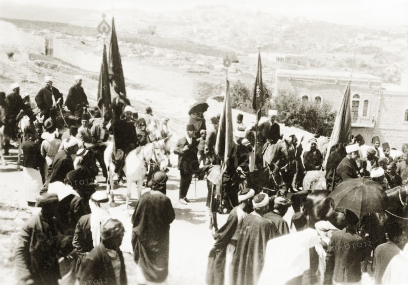 Nebi Musa procession in Ramallah. Muslim pilgrims bearing flags take part in a Nebi Musa procession: an annual pilgrimage made by Palestinian Muslims to Nebi Musa near Jericho, the supposed burial place of Moses. Ramallah, British Mandate of Palestine (West Bank, Middle East), circa 1938. Ramallah, West Bank, West Bank (Palestine), Middle East, Asia.