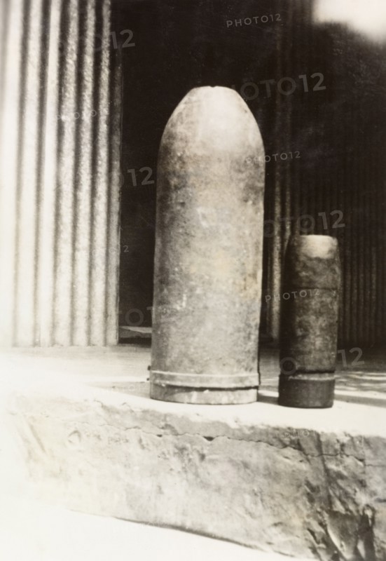 Bombs from Palestine. Two bombs, made of 'old shell' according to an original caption, sit side by side on a stone step. British Mandate of Palestine (Middle East), circa 1938., Middle East, Asia.