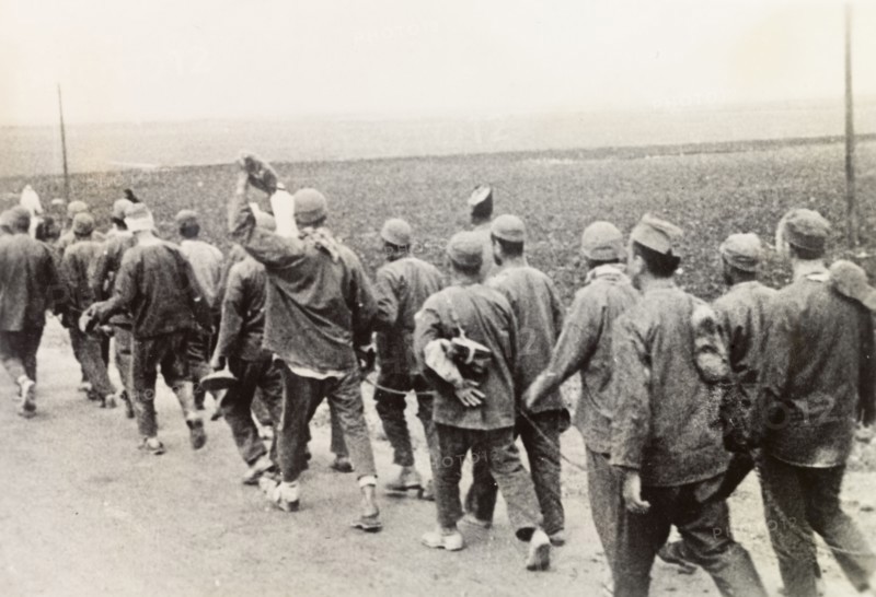 Convicts on way to work, Palestine. A chained group of Arab convicts walk along a road on their way to work during the Great Uprising (1936-39). British Mandate of Palestine (Middle East), circa 1938., Middle East, Asia.