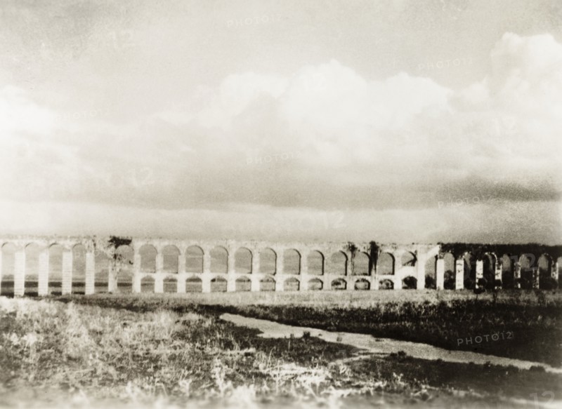Roman aqueduct near Acre. The remains of a Roman aqueduct near Acre, which once brought freshwater to the port city from springs located at Cabri (Kabri). Near Acre (Akko), British Mandate of Palestine (Northern Israel), circa 1938. Akko, North (Israel), Israel, Middle East, Asia.