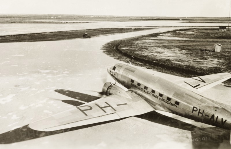 Dutch aeroplane on Lydda runway. A KLM Royal Dutch Airlines aeroplane, the PH-ALV 'Valk', sits on the runway at Lydda Airport. Lydda, British Mandate of Palestine (Lod, Israel), circa 1938. Lod, Central (Israel), Israel, Middle East, Asia.