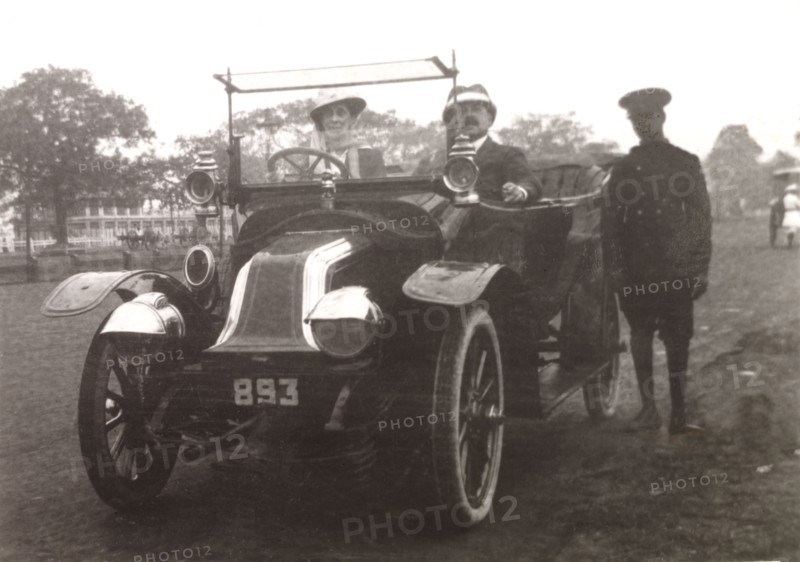 Minnie Murray drives a Renault car. Minnie Murray sits behind the wheel of a Renault car with her husband James who travels in the passenger seat beside her. Calcutta (Kolkata), India, 1908. Kolkata, West Bengal, India, Southern Asia, Asia.