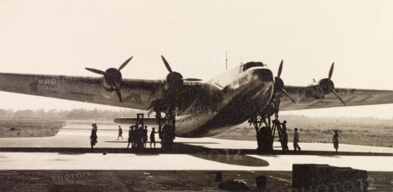Euterpe' at Dum Dum Airport. Imperial Airways aircraft 'Euterpe' is parked for refuelling on the runway at Dum Dum Airport (now Netaji Subhash Chandra Bose International Airport). Dum Dum, Calcutta (Kolkata), India, December 1938. Kolkata, West Bengal, India, Southern Asia, Asia.