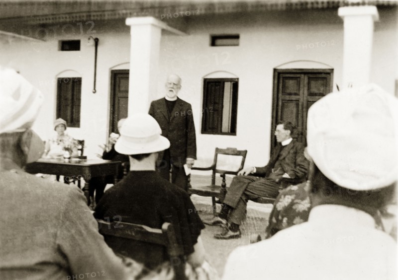 Opening of a new nurse's accommodation. Reverend George Sawday addresses a seated audience during the opening ceremony of new trainee nurse's accommodation at Holdsworth Memorial Hospital. The hospital was run by Methodist missionaries, who provided three year training courses for nurses. Mysore, India, January 1934. Mysore, Karnataka, India, Southern Asia, Asia.