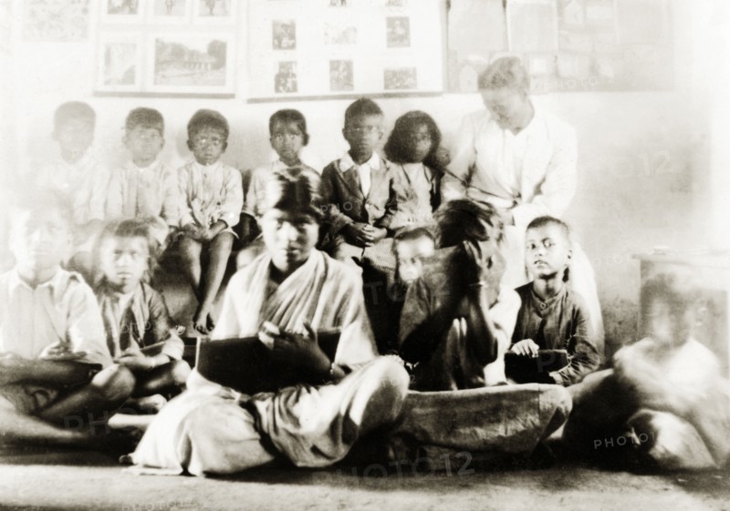 Class of Indian schoolchildren. A mixed gender class of Indian schoolchildren listen and take notes during a lesson at a Methodist mission school. Tumkur, Mysore State (Tumakuru, Karnataka), India, 1932., Karnataka, India, Southern Asia, Asia.