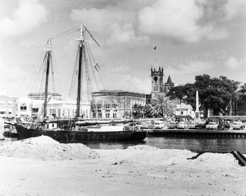A ketch in the Careenage at Bridgetown. A ketch (twin-masted sail boat) sits at anchor in the Careenage. Bridgetown, Barbados, 1965. Bridgetown, St Michael, Barbados, Caribbean, North America .