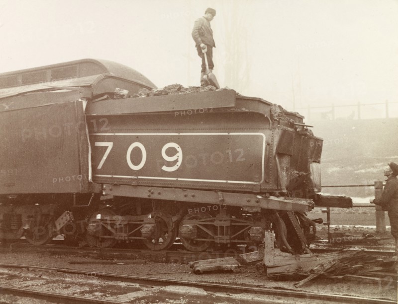 Train crash, Ontario. Railway workers inspect the damage caused to the rear of a steam locomotive after a train crash on the Hamilton railway line. Hamilton, Canada, February 1902. Hamilton, Ontario, Canada, North America, North America .