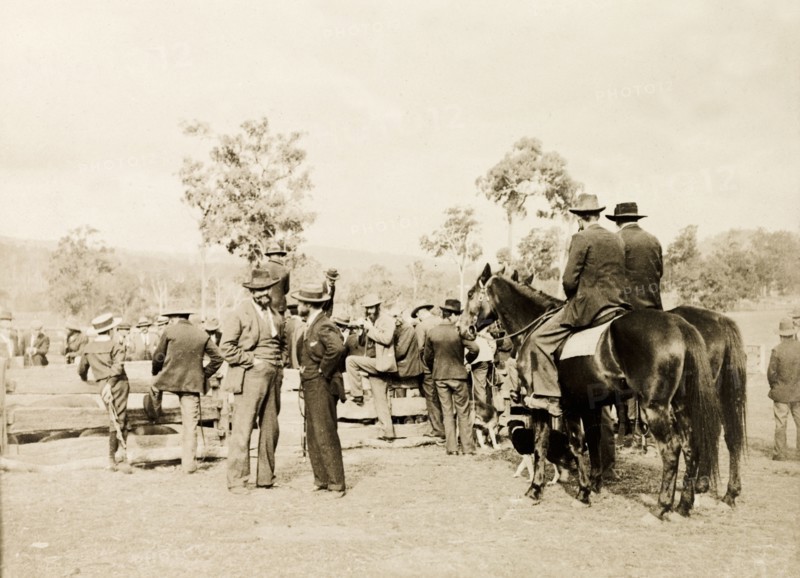 Men at an Australian sheep station. A large group of men, two on horseback, crowd around a wooden enclosure at a sheep station. Australia, May 1902. Australia, Australia, Oceania.